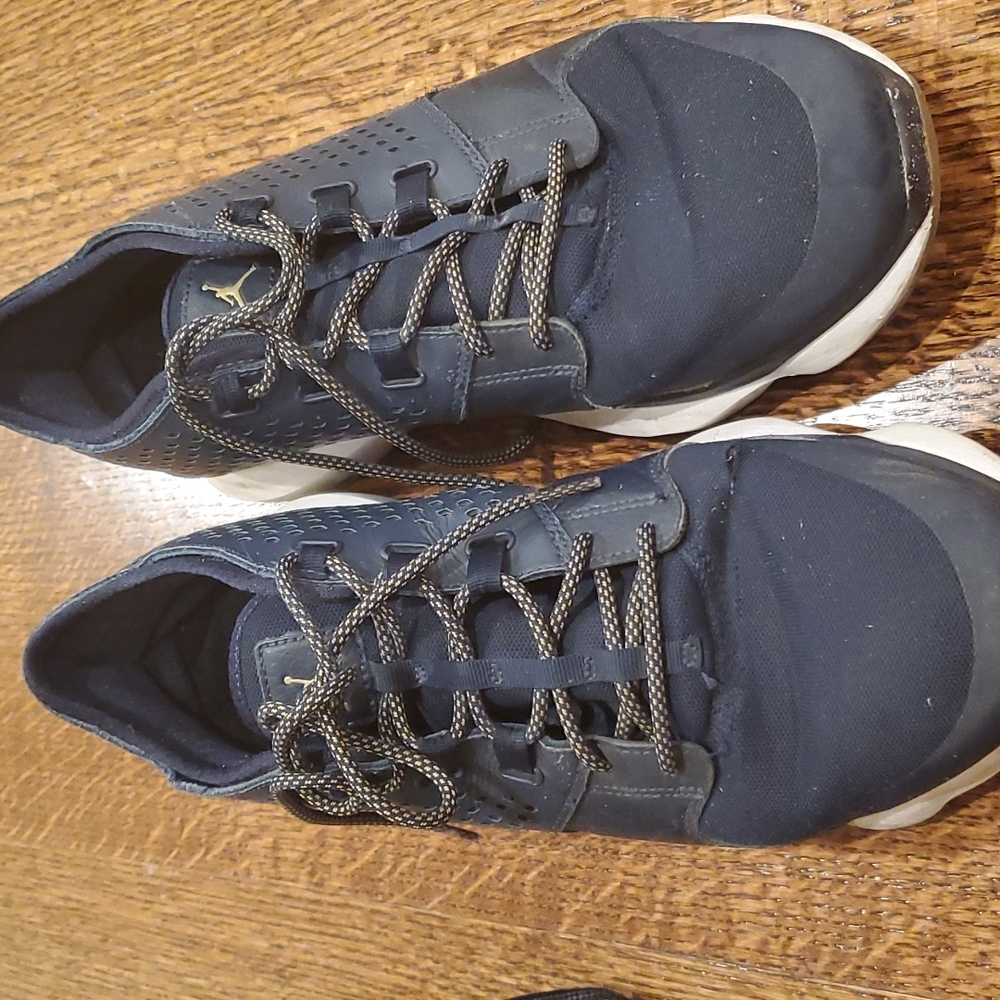 Jordan sneaker it wore couple of times there is small tear on left shoes